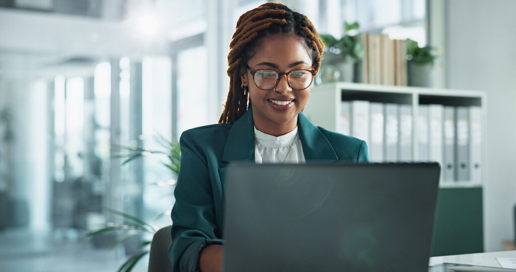 Smile, laptop and glasses with business woman in office for online, research or corporate governance specialist. Stakeholder email, crm manager and news with person in firm for report and compliance.